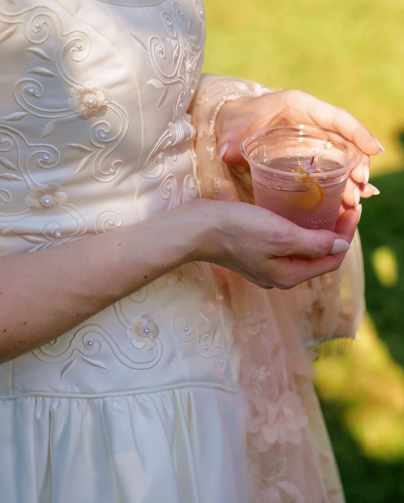 Bride holding a custom wedding cocktail