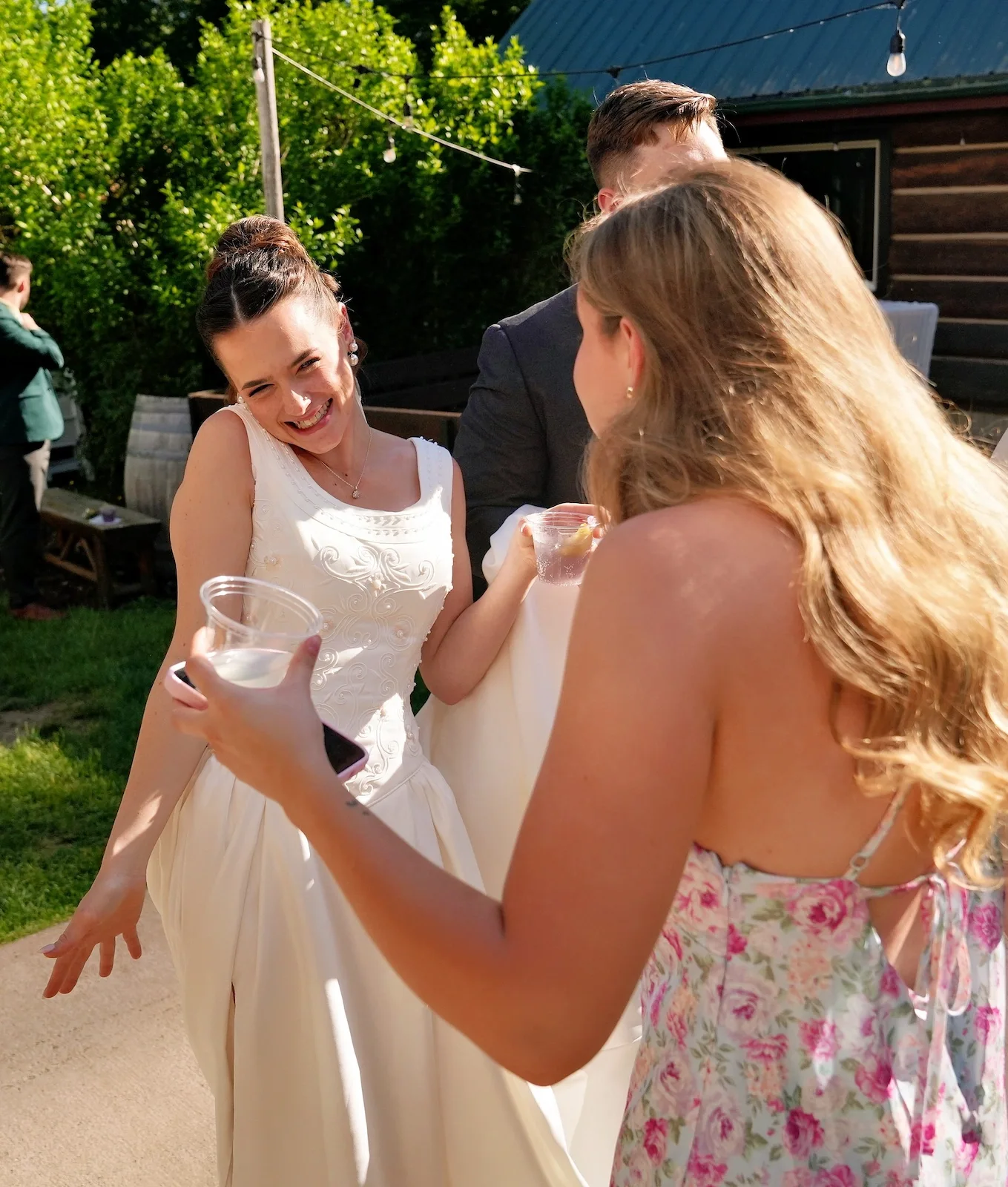 Bride celebrating with a cocktail at her reception